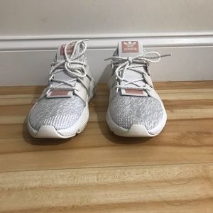 Adidas pair of sneakers